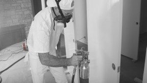 man using fine finish sprayer
