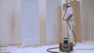 man using fine finishing sprayer